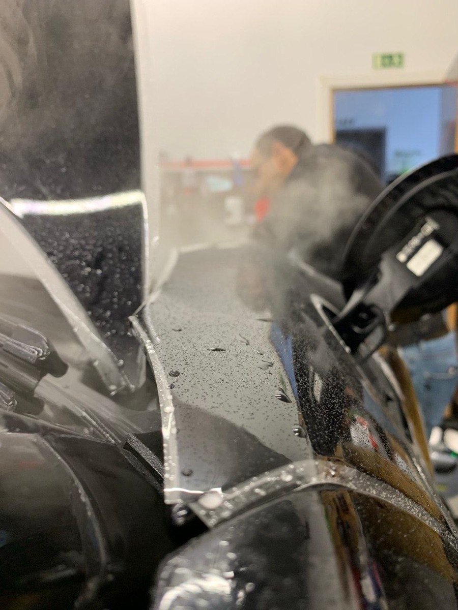 Protective film applied around a headlight